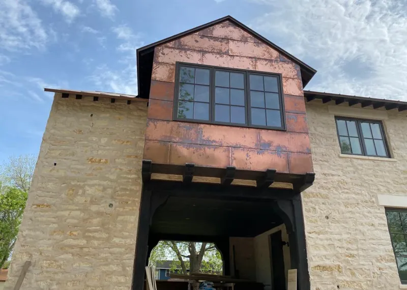 Copper metal panel facade on a stone building for Metal Roof Coating in Fircrest